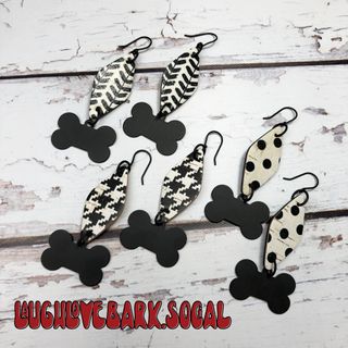 Black and white classic earrings with dog bone dangles. Why, yes, please. So, I have to admit, these are some of my favs! Choose from polka dots, houndstooth and arrows! 🐶 #dogbones #laughlovebark