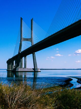 Framed Echoes: Raised legacies — quite literally. This bridge takes its name from Vasco da Gama.

Who was he, you ask? A Portuguese explorer who, back in 1498, became the first European to reach India by sea. Fast-forward 500 years later, and this bridge was inaugurated in 1998 to mark that historic route — a pretty fitting tribute to one of the biggest names from the Age of Discovery.

Honestly, I didn’t expect it to be this long. The only other time I remember a drive lasting over 20 minutes on a bridge was heading from Miami down to the Keys.

Shot on the Sony ZV-E 10 II