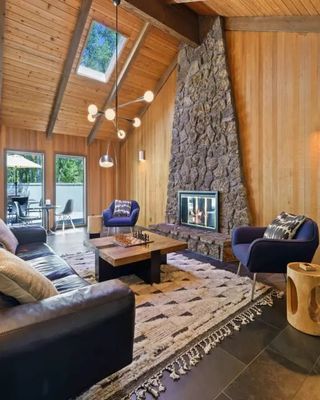 Beautiful cedar ceilings, a stone fireplace, and a chef's kitchen made for making memories — welcome to your Oregon getaway. The hot tub and complimentary bikes are waiting for you. Book now in link in our bio!