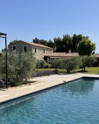 Mas de l'Odyssée | Modern New Build with Alpilles Views 🏔️✨
📍 Eygalières · Near Saint-Rémy-de-Provence · Alpilles · Provence
Sleeps 10 · 5 Bedrooms · 4 Bathrooms

At the foot of the Alpilles and only a ten-minute walk from the quaint village of Eygalières, this rare, spacious new build offers a modern and stylish feel. The icing on the cake? Its exceptional panoramic view of the surrounding nature and the famous Alpilles mountains.

🏛️ Open-plan living, bright bedrooms
Spanning approximately 250 square meters, the property comfortably accommodates ten guests in five air-conditioned bright bedrooms. The modern living room, dining area, and kitchen are open plan—keeping the family together no matter the activity—with a cozy TV snug for quieter evenings in. The ground floor boasts a bright ensuite master bedroom with direct access to the garden. The second story offers four colorful bedrooms and three bathrooms.

🌿 Heated pool, panoramic mountain views
The large garden offers spacious lawns, olive trees, and many plants and flowers. The lovely heated pool invites relaxation while admiring panoramic views of the mountains and surrounding nature. Outdoor seating areas beneath a pergola overlook the garden, while a ping-pong table and private pétanque court ensure there's always something to keep you entertained.

🍷 A Provençal dream in the Alpilles
From mingling with local life at the weekly market and tasting regional products to relaxing in the quiet of the countryside and exploring the wonders of the region, Mas de l'Odyssée is perfectly positioned for both village charm and natural beauty.

Ideal for families seeking modern comfort, walkable village access, and spectacular Alpilles views.

Start planning your holiday in Provence with a free consultation with one of our Villa Rental Specialists:
https://my.onlyprovence.com/s/property?name=ODYSSEE

Weekly rates starting from €6,750.