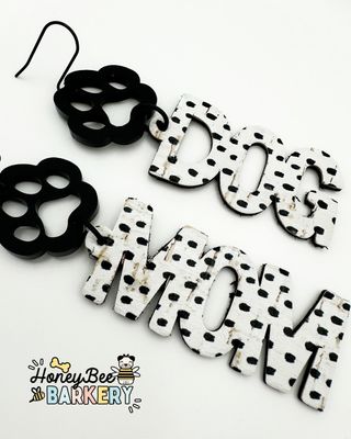 Pawsitive you're a Dog Mom? 🐾 Then flaunt it with these ridiculously fun, funky black and white earrings!  The polka dot leather backed cork is adorned with a matte black acrylic charm with stainless steel ear hooks. Other colors and corks available for all Dog Moms! Sniff it all out on my website and let me know which one is your fav! 🐶 #honeybeebarkery