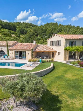 Book your dream Provence holiday at Mas Allure, a luxury villa set in the heart of the Alpilles natural park among olive groves, with daily breakfast and a saltwater pool.
📍 Maussane-les-Alpilles · Near Saint-Rémy-de-Provence · Alpilles · Provence

This fully air-conditioned villa sleeps 12 across six ensuite bedrooms, four in the main house and two in independent annexes. Completely renovated and tastefully decorated with sumptuous materials and stunning handmade doors, it's truly one of a kind. The main level offers a luxurious kitchen and dining room with a wine cellar and a large living room with an open fireplace.

An oasis of peace, the estate boasts a large terrace with spectacular views, two covered seating areas, and a 17x5-meter heated saltwater pool, plus a sauna, gym, minibar, and pétanque court. Daily cleaning and daily breakfast mean it caters effortlessly to everyone, from couples to multi-generational groups and families with young children. Golf is a 5-minute drive, hiking trails start from the house, and Saint-Rémy-de-Provence is just 15 minutes away.

Start a conversation with a Villa Rental Specialist today to check availability at the link in our bio.

Weekly rates starting from €9,900.